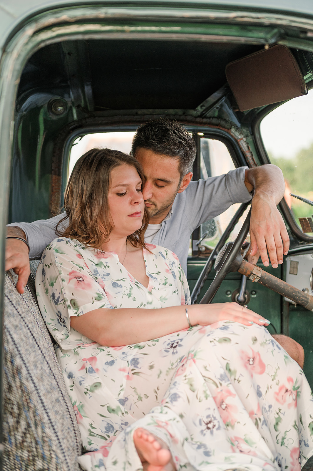 couple sitting in old truck at country joy flowers
