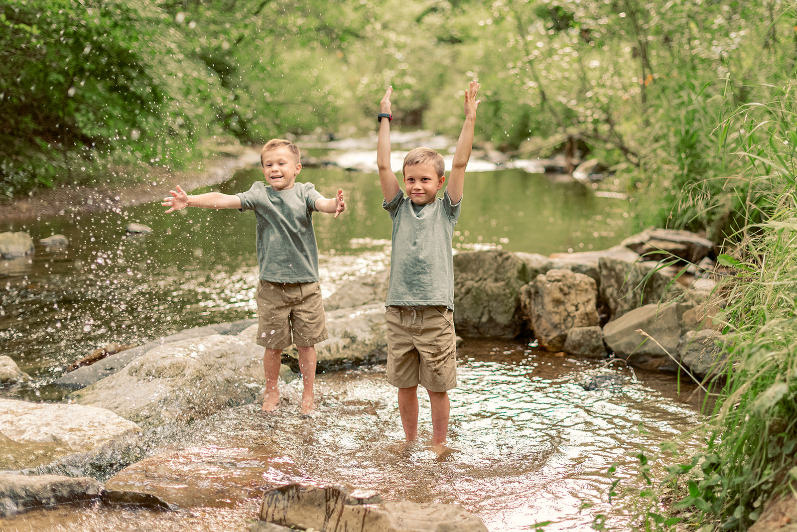 Kids splashing in creek during family photo session at Mill Creek Preserve in York PA