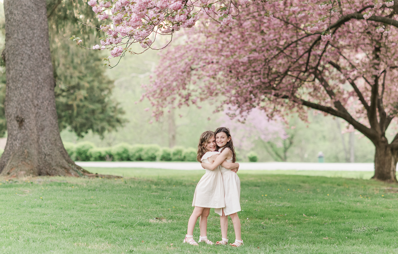 Family enjoying the vibrant spring blooms at Lancaster County Park, capturing timeless moments with a seasoned photographer in Lancaster, PA