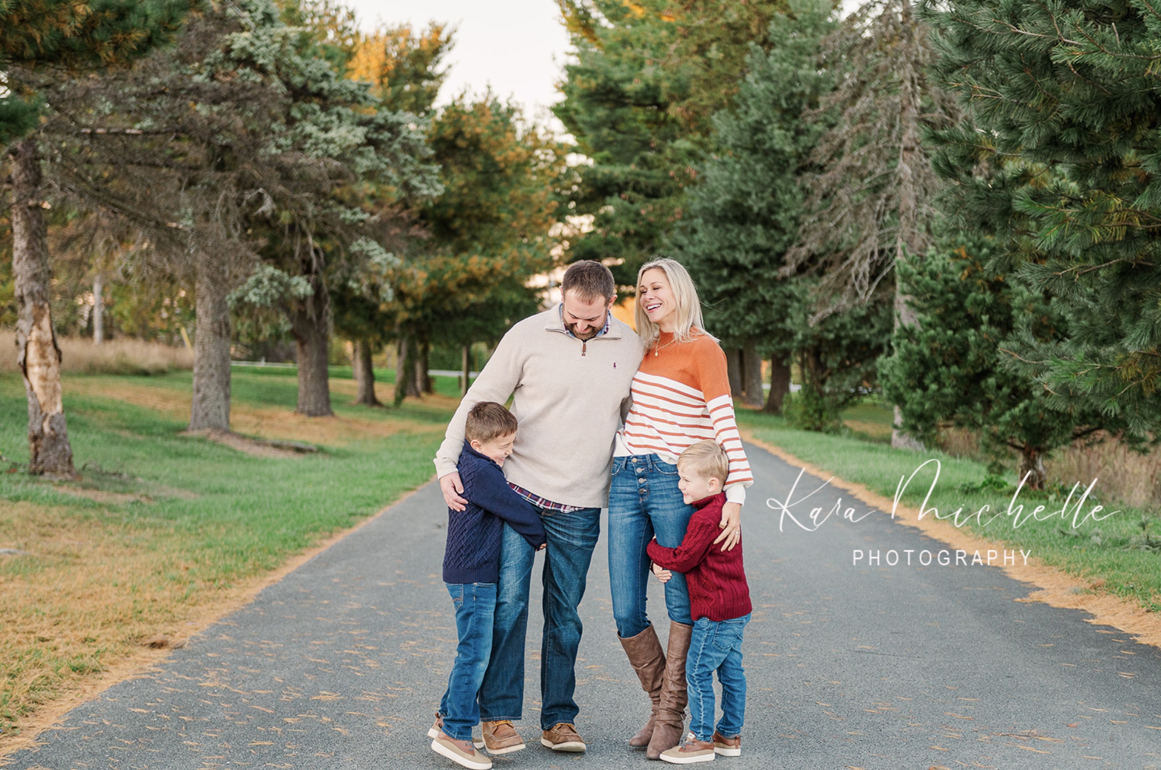 Family of four posing at sam lewis state park during fall mini session by photographer pa