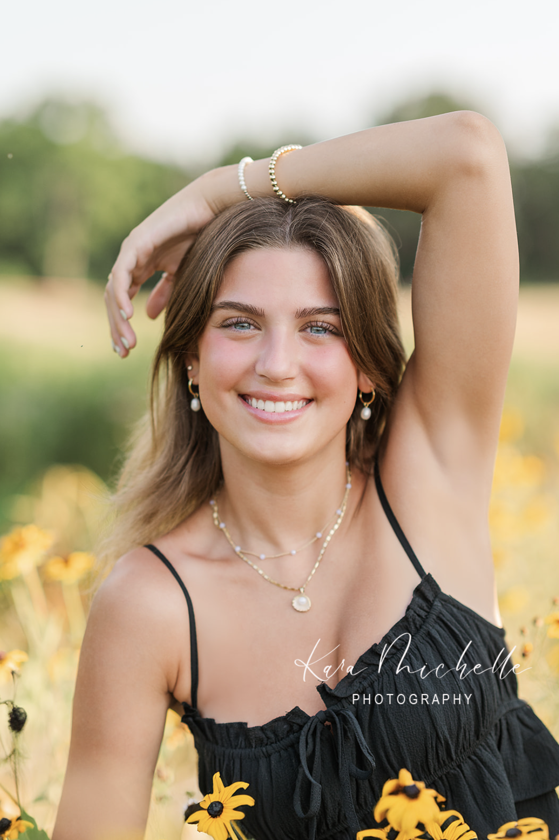 Girl posing in flowers by senior photographer york pa