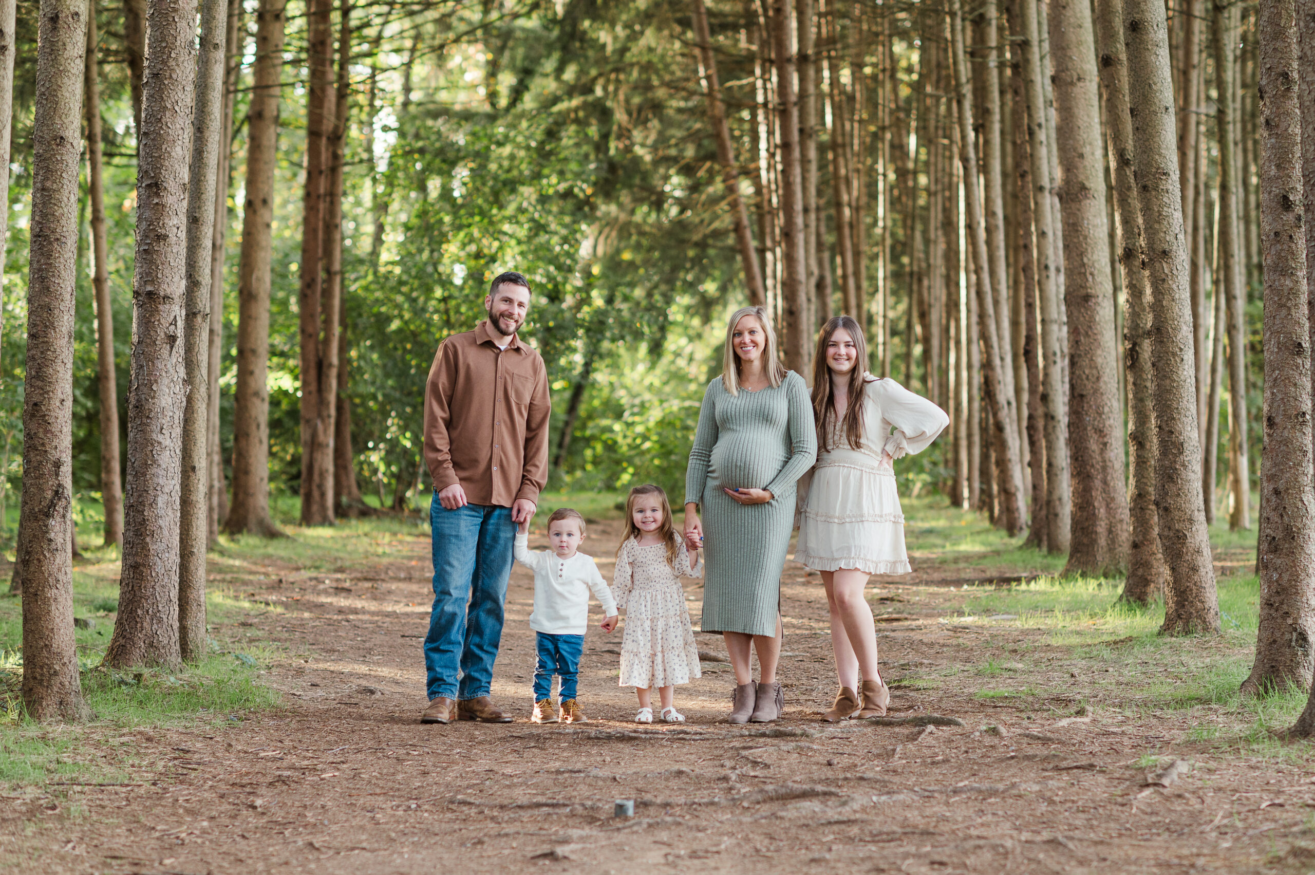 Family posing together during maternity session by lancaster pa photographer