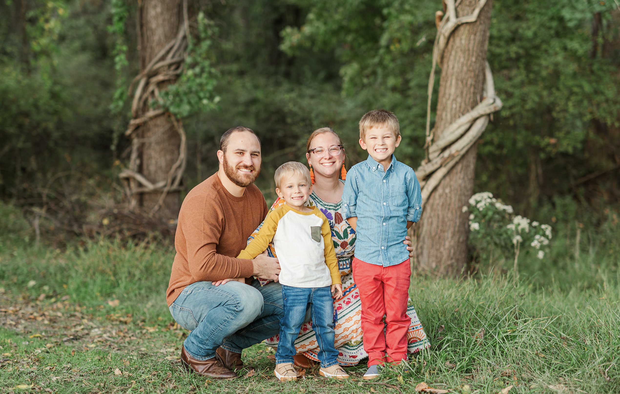 Family posing together at family farm by york pa photographer