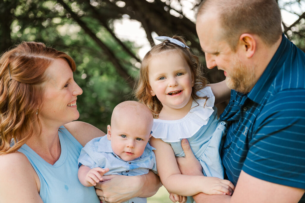 family of four posing together by york pa photographerr
