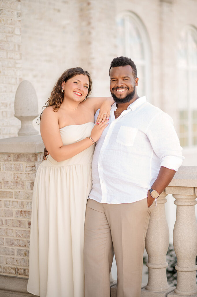 engaged couple smiling together during engagement session at Hershey Gardens in Pennsylvania