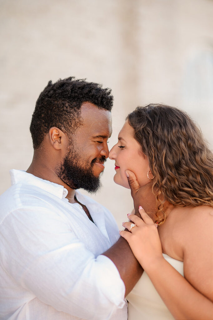 engaged couple smiling with foreheads touching during romantic session in Lancaster PA