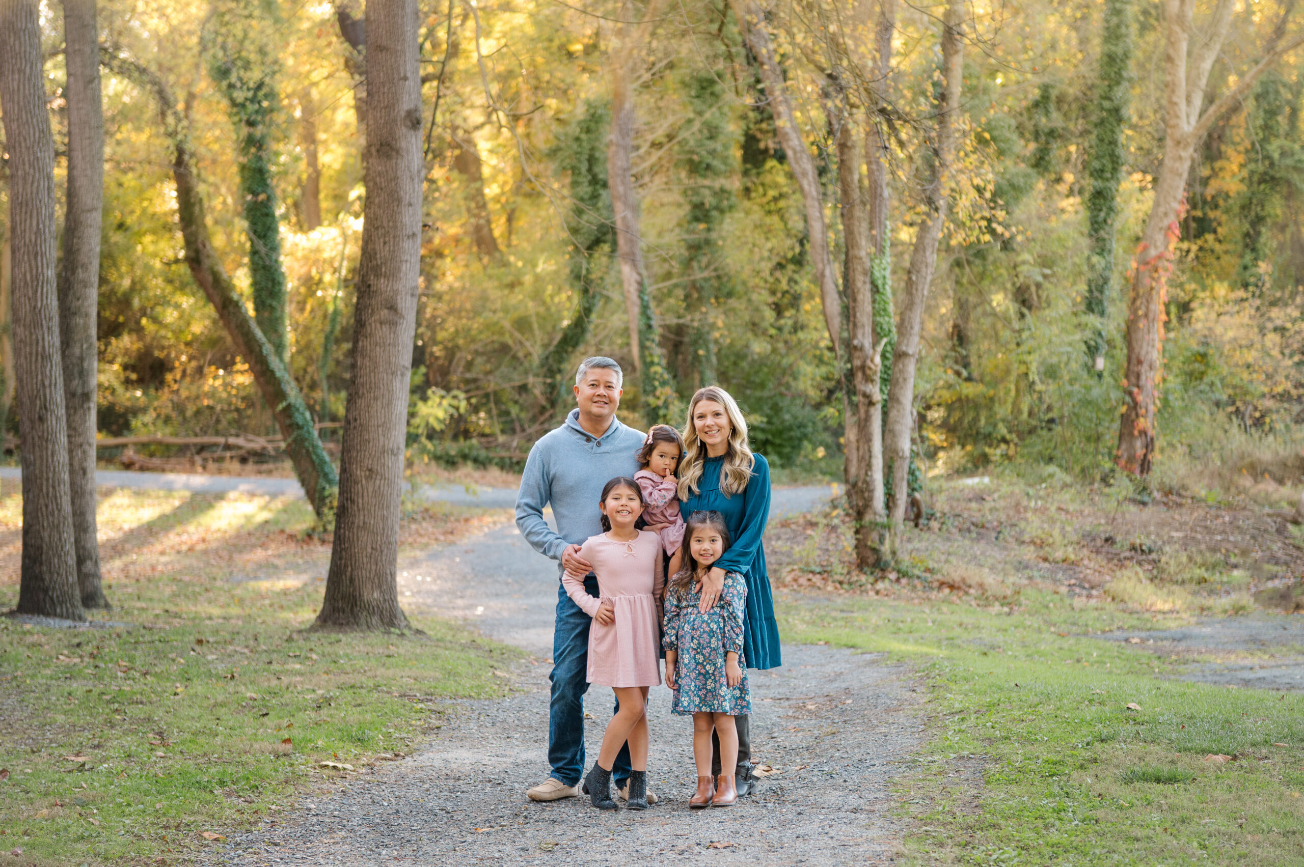 Family wearing neutral outfits for fall family photos in York and Lancaster, PA