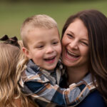 Mom laughing with her children during a Mommy & Me mini session in York and Lancaster, PA