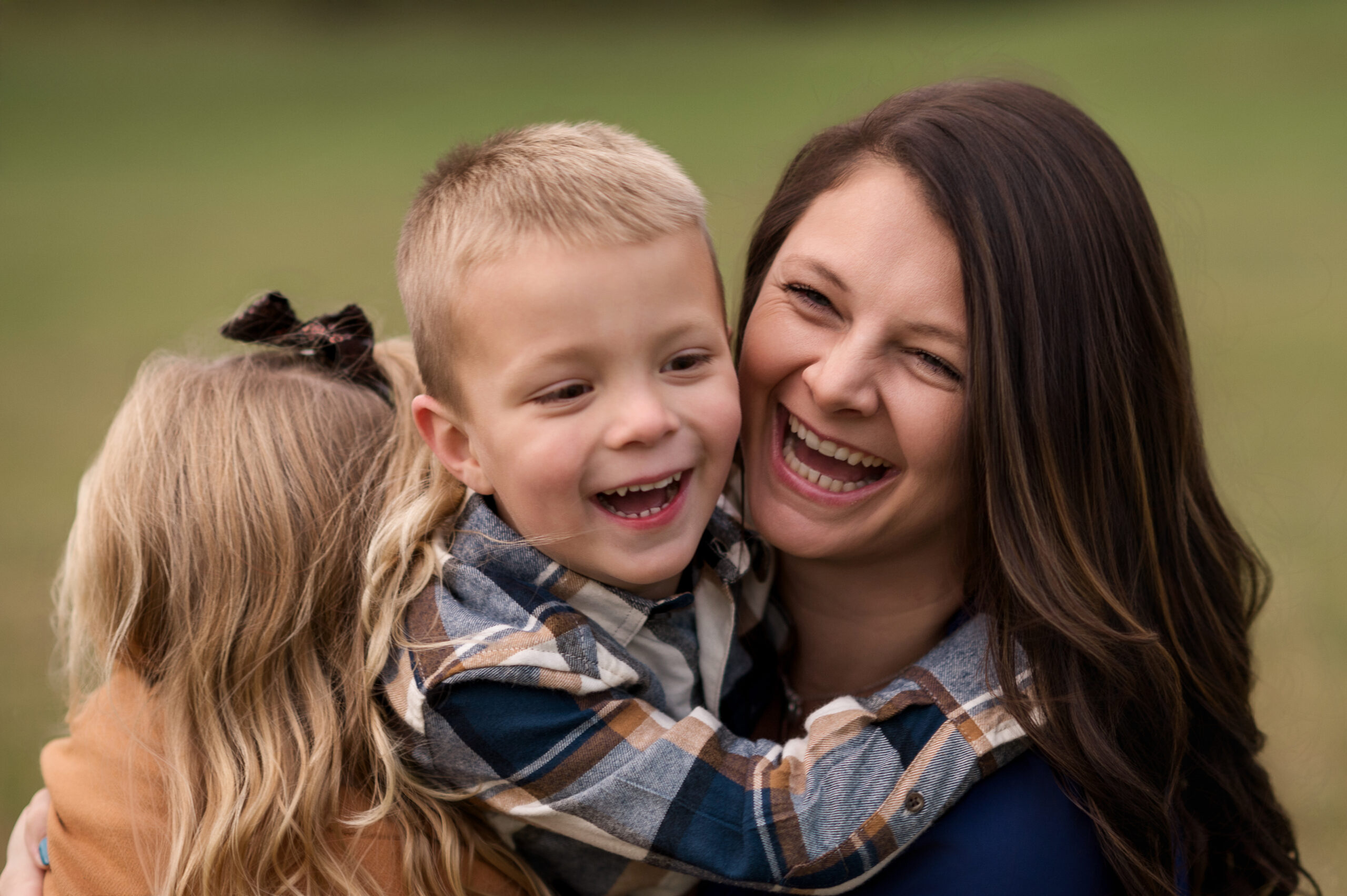 Mom laughing with her children during a Mommy & Me mini session in York and Lancaster, PA