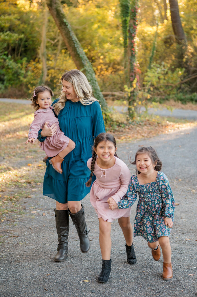 Mom walking with her children during an outdoor Mommy & Me session in Lancaster, PA
