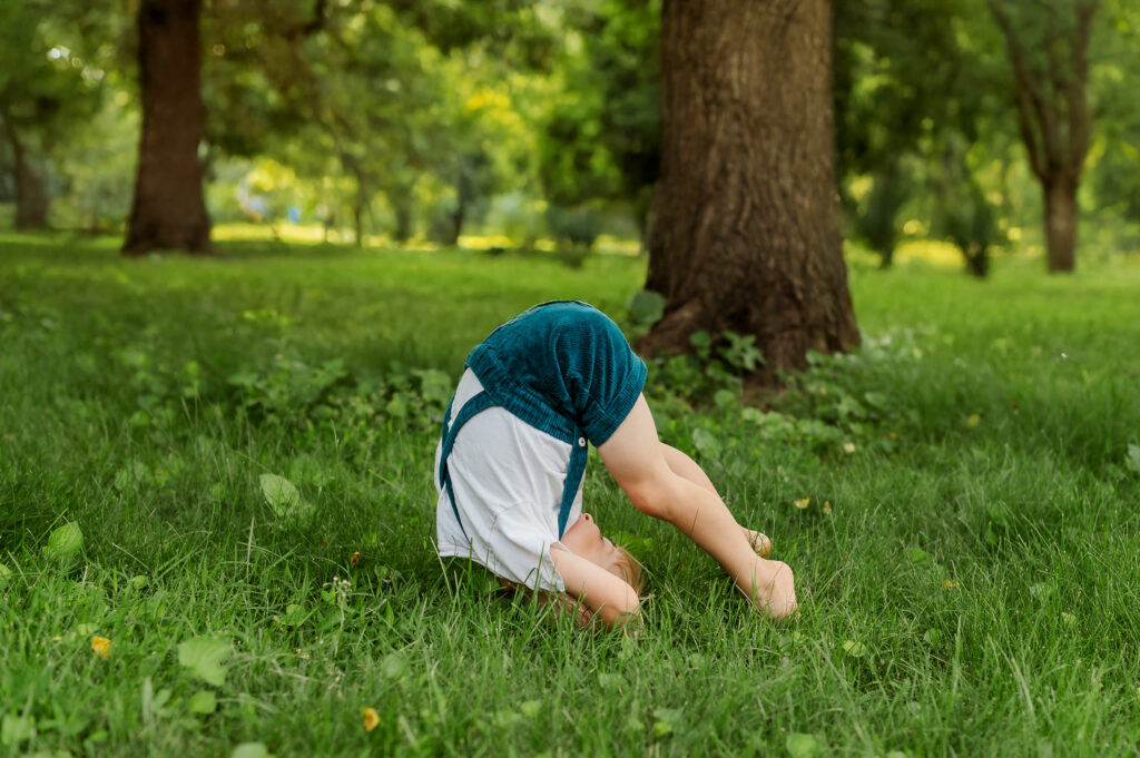 A toddler playing in the grass during a relaxed Story of Home family photography session in York, Pennsylvania.