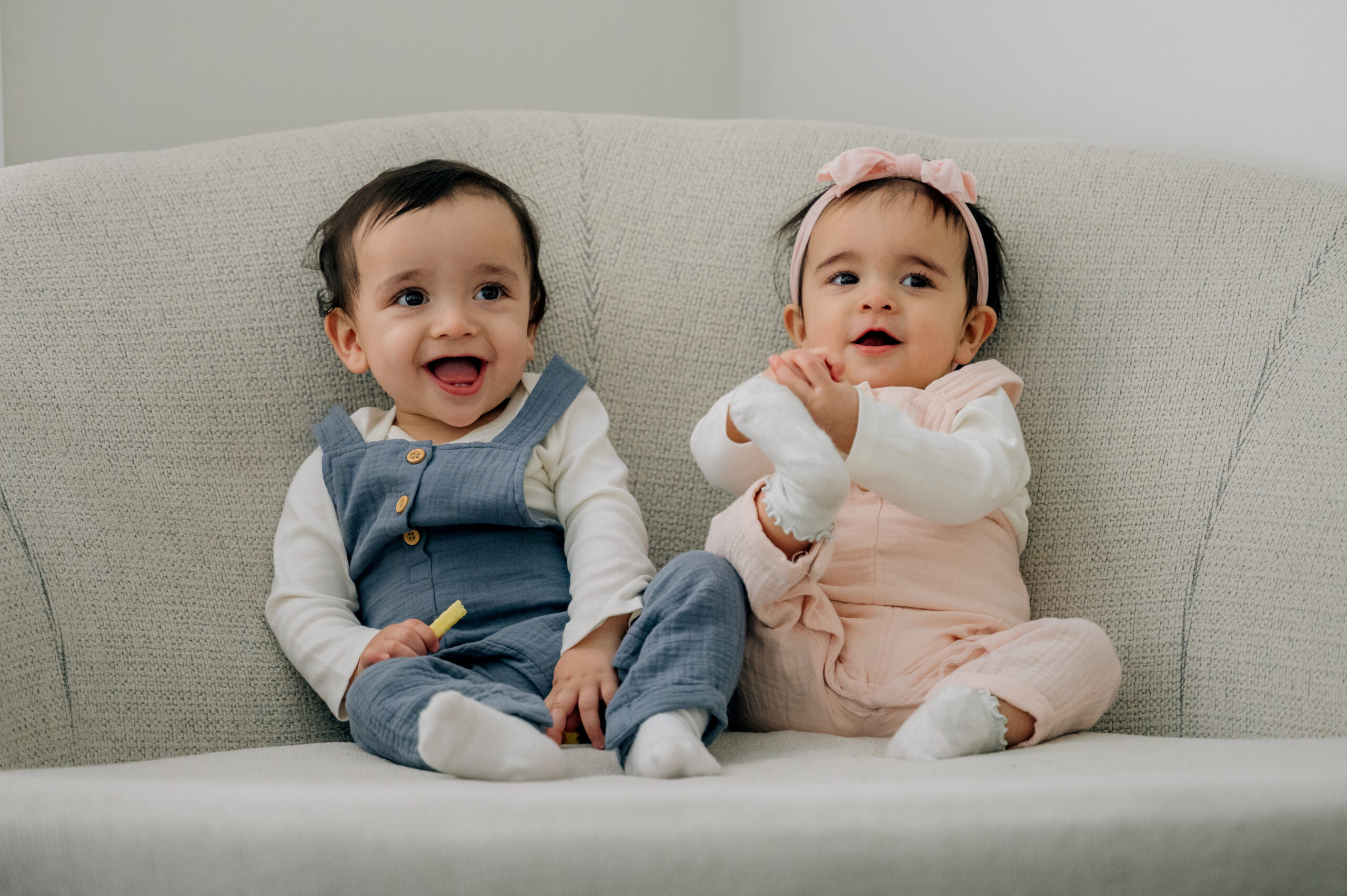 Twins sitting together during a baby sitter milestone session in Lancaster, PA