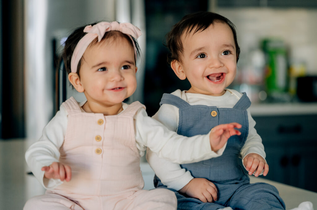 Babies smiling during a sitter milestone session in Lancaster PA