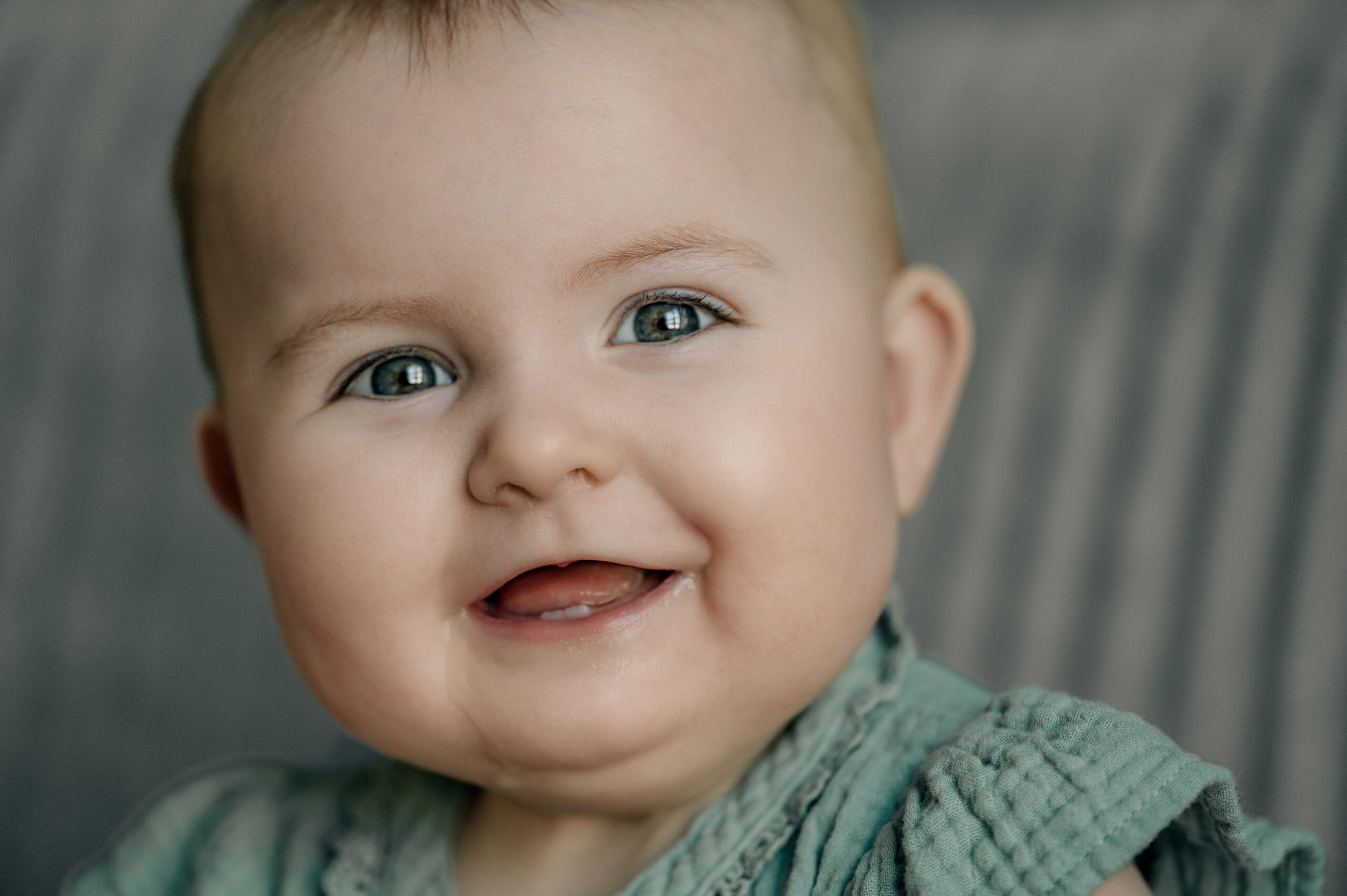 Smiling baby during a sitter session photographed by a York PA baby photographer