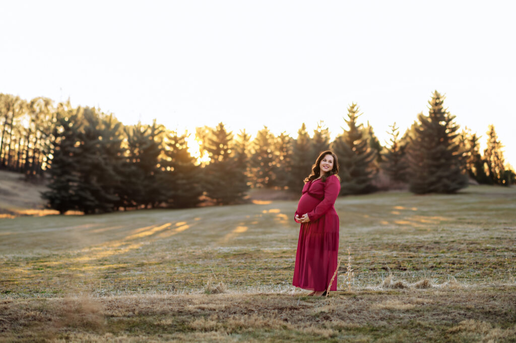 pregnant mother holding baby bump during maternity session in York Pennsylvania