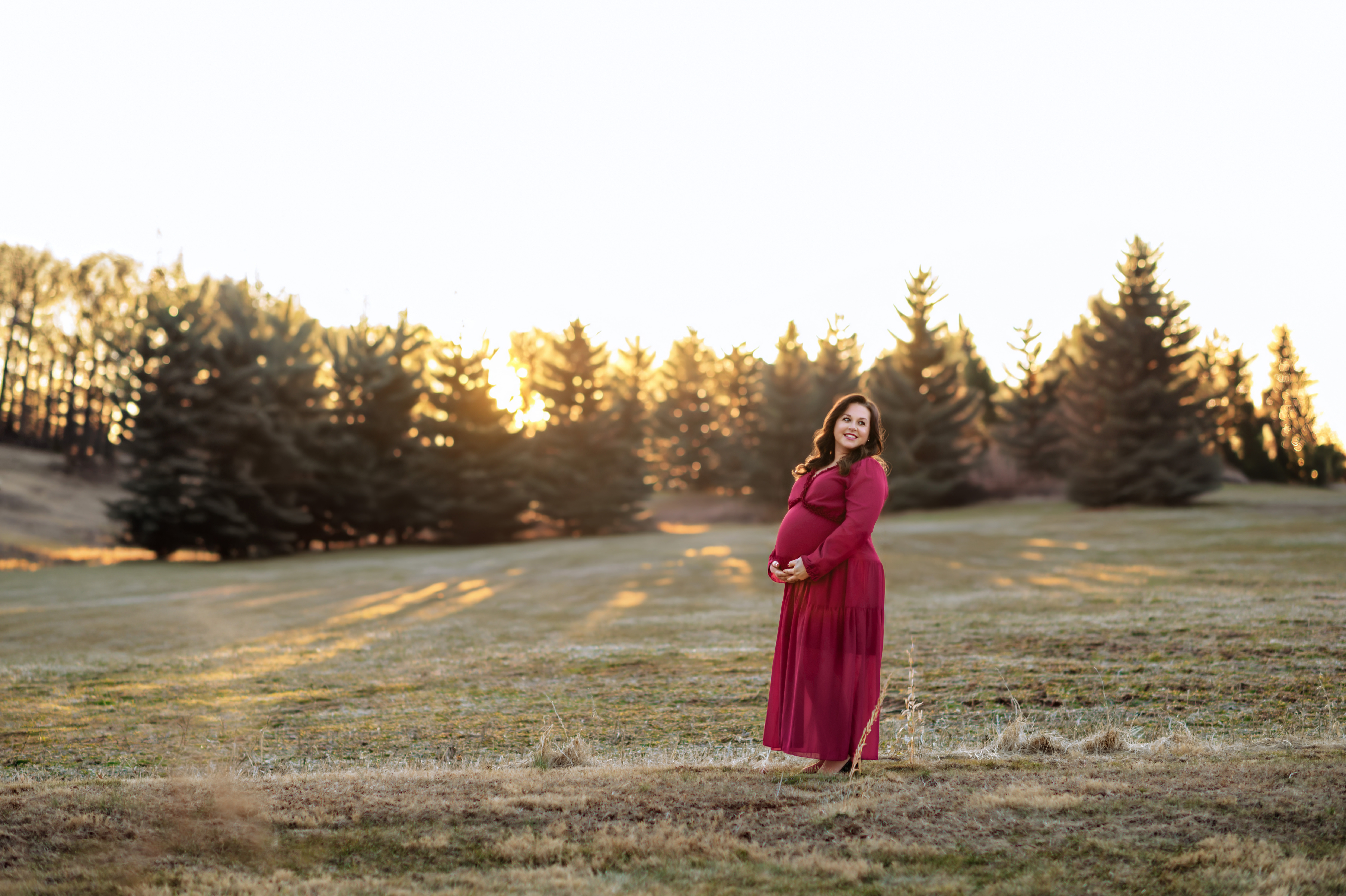 pregnant mother holding baby bump during maternity session in York Pennsylvania