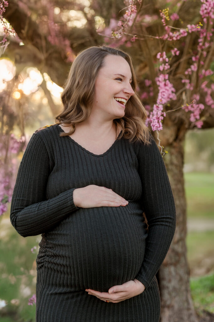 pregnant mother holding baby bump during maternity session in York Pennsylvania