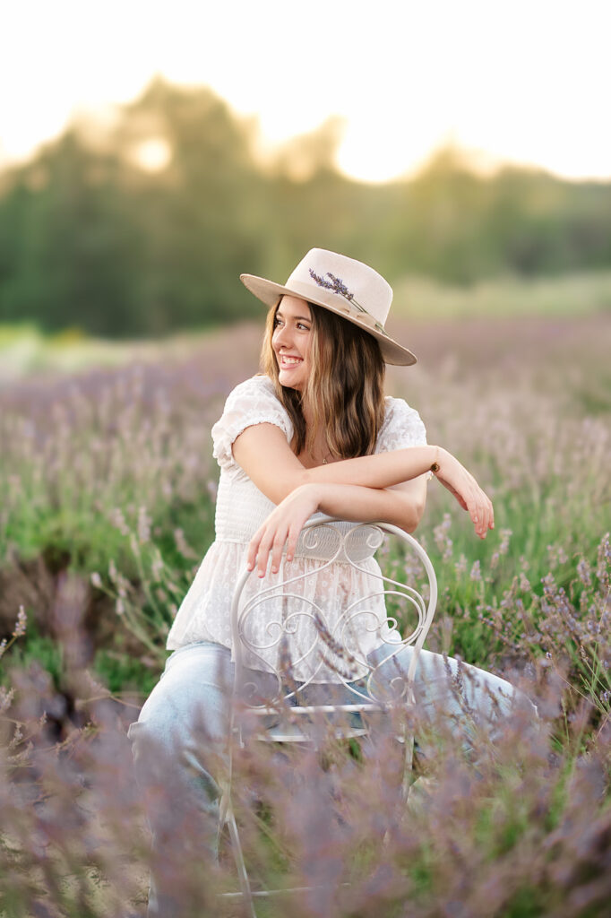 high school senior sitting in lavender field during sunset session in Lancaster PA