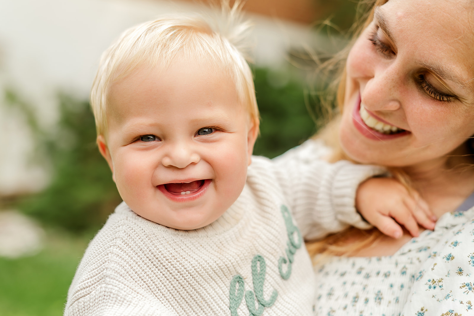 Smiling baby being held by mom during a mommy and me photography session in York PA