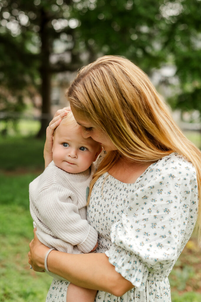Mom holding and kissing her baby during a mommy and me photography session in Lancaster PA