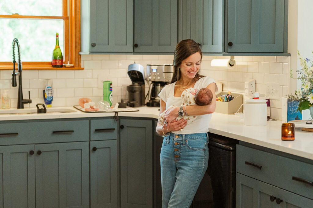newborn baby resting on mothers chest during first week home