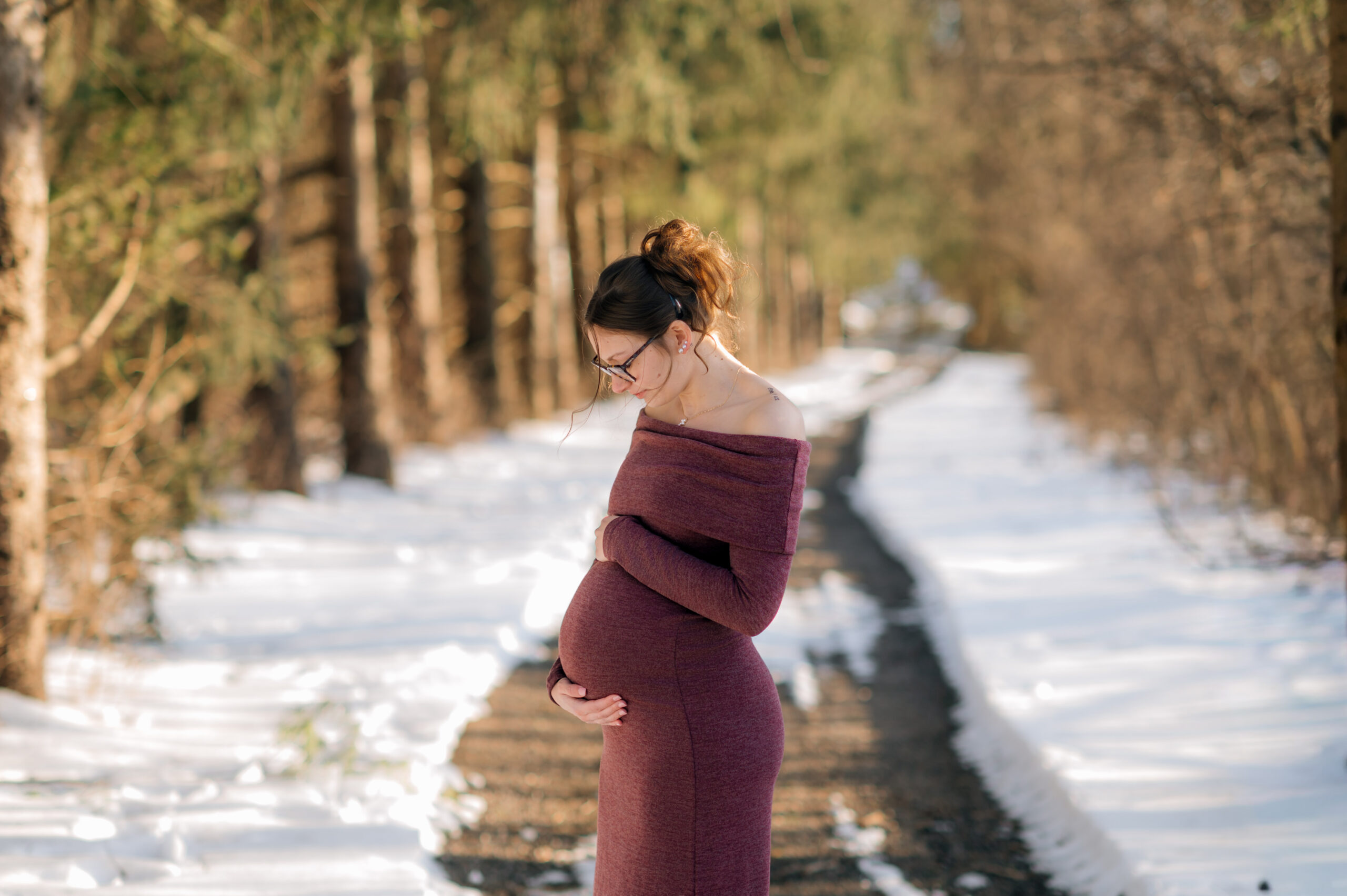 pregnant mother holding baby bump during maternity session in York Pennsylvania