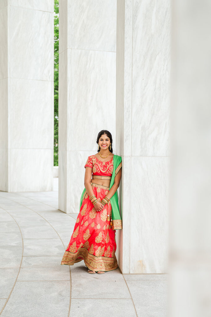 high school senior wearing traditional cultural outfit during senior photo session at Pennsylvania State Capitol