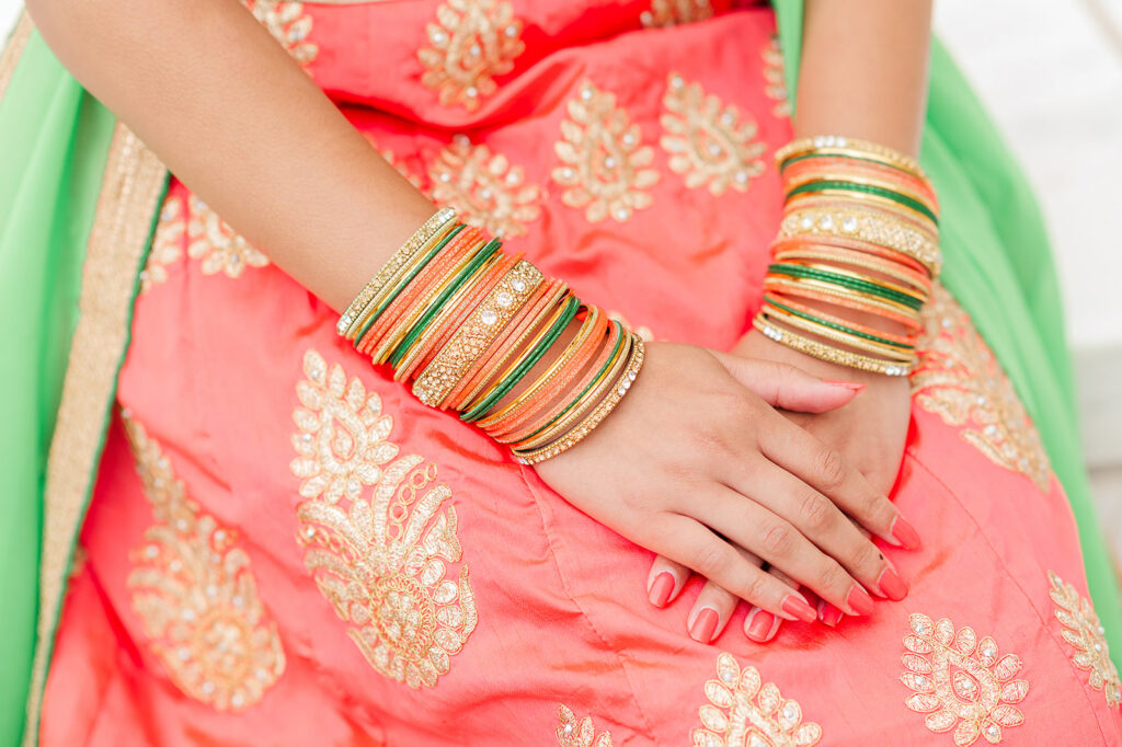 close up of traditional jewelry and embroidered fabric during senior photo session in Pennsylvania