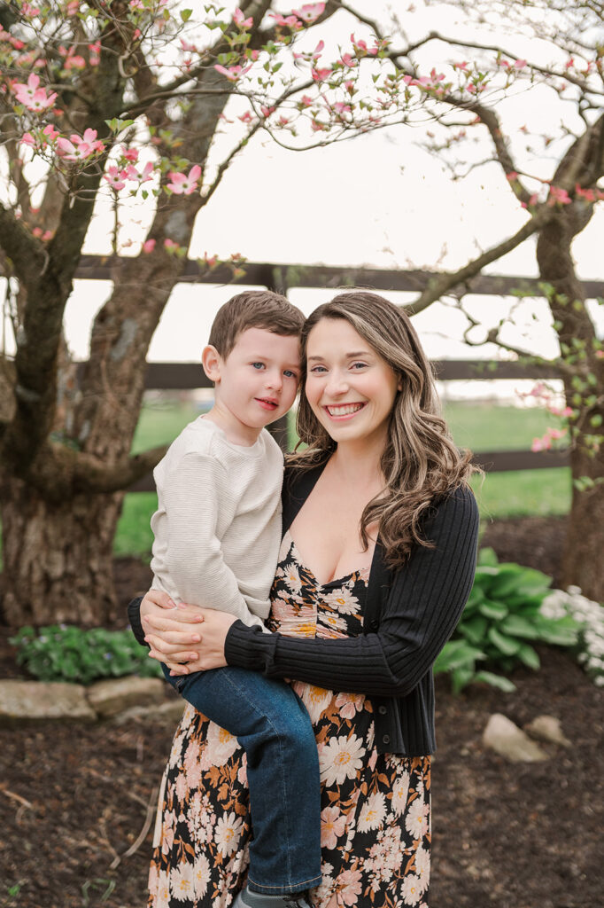 family smiling during spring photo session 