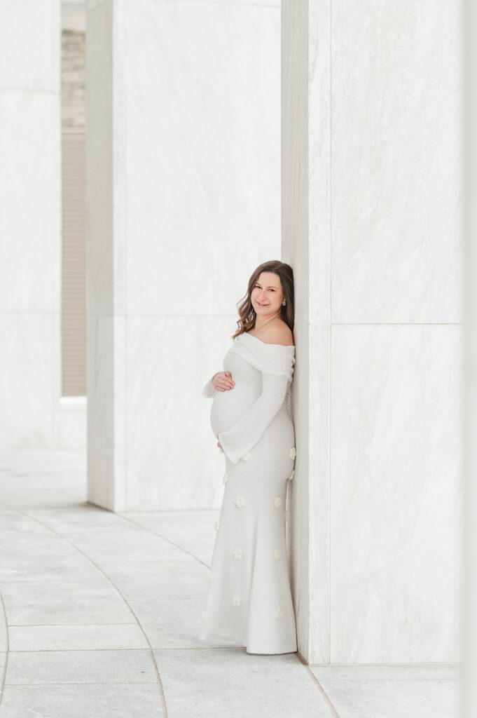 pregnant mother in white dress during maternity photography session in York PA