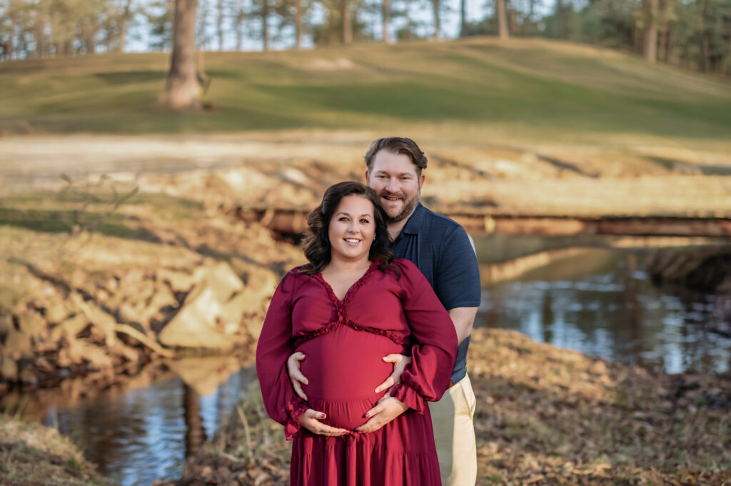 expecting couple standing together during outdoor maternity session in York PA