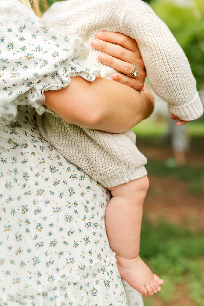 Close-up of a mother holding her baby during a natural outdoor family photo session in York, PA